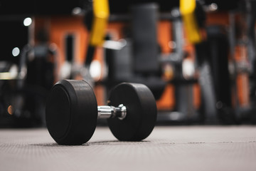 Gym and dumbbell weight training equipment on sport ,Healthy life and gym exercise equipments and sports concept ,copy space