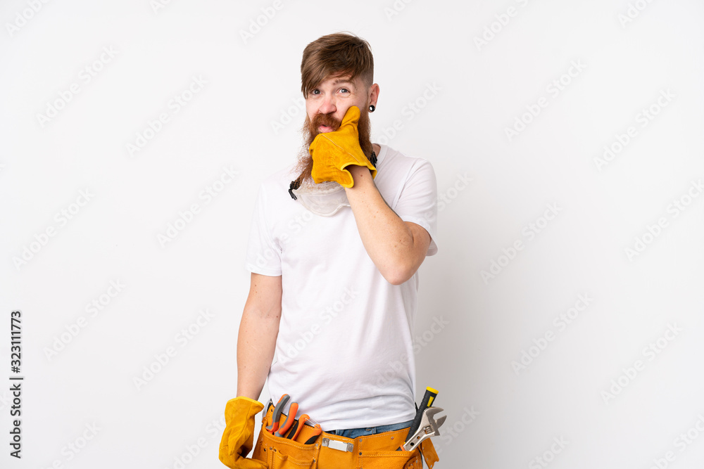 Redhead electrician man with long beard over isolated white background thinking an idea Redhead electrician man with long beard over isolated white background thinking an idea