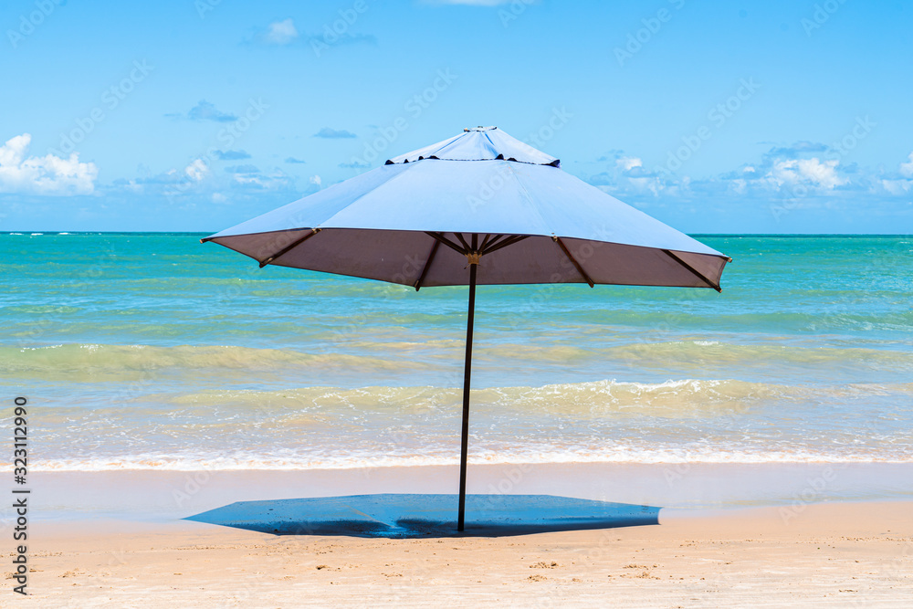 blue umbrella against a blue sky