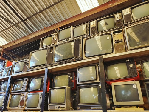 Pattern wall of pile retro television (TV) - vintage filter effect style