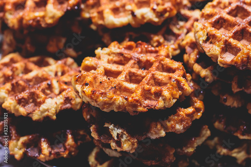 Photography Fresh belgian stroopwafels waffles with caramel and chocolate, street food on tr