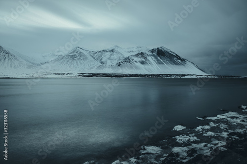 Mountains in Borgarnes, Iceland. Night long-exposure photo of river and mountains in Iceland.