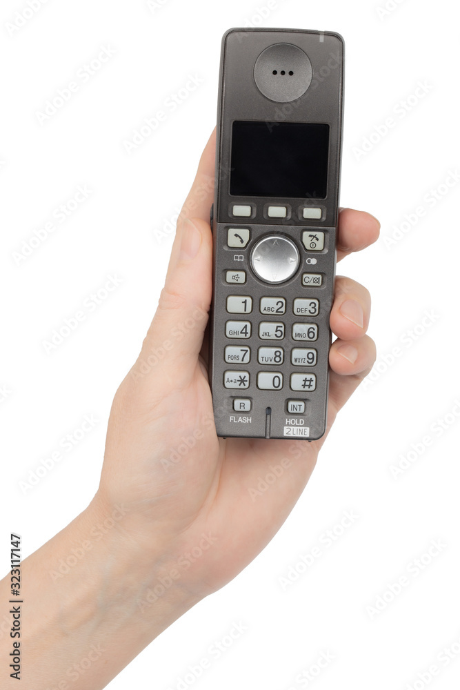 Female hand holds a phone, isolated on white background Female hand holds a phone, isolated on white background