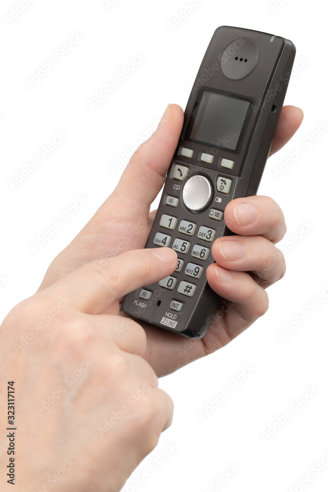 Female hand holds a phone, isolated on white background Female hand holds a phone, isolated on white background