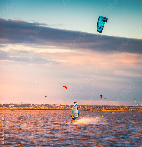 Photography Kite Surfers and Wind Surfer at Neusiedl Lake in Podersdorf, Austria at Sunset