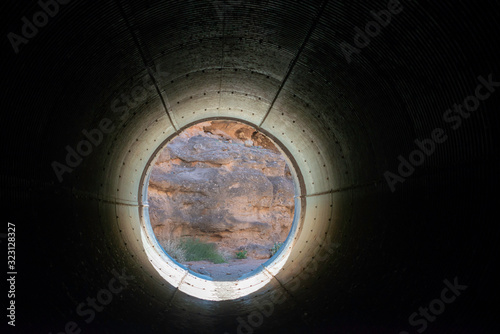 USA, Nevada, Clark County, Lake Mead National Recreation Area. The White Owl Canyon Trail goes through a 10 ft culvet tunnel under the road.