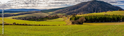 Obraz na plátne panorama of green meadows and uninhabited villages in the highlands, spain