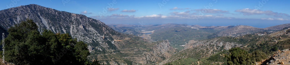 panorama, view in the mountains, with a beautiful panoramic view about a green valley 