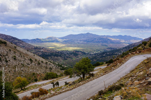 road in the mountains, with a beautiful panoramic view about a green valley 