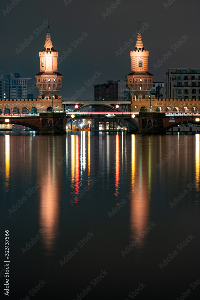 night view of city of germany, view of the oberbaum bridge with reflection of lights in the river spree