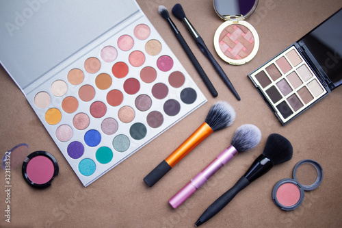 Makeup studio with all the accessories such as shadow palettes, concealers, makeups, eyeliners, brushes, lipstick and highlighter