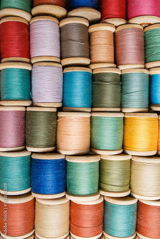 rolls of colorful threads, close-up and top view. rolls of colorful threads, close-up and top view.