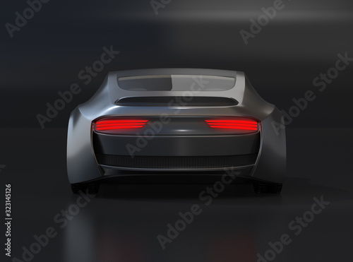 Rear view of black electric sports coupe on black background. 3D rendering image.  © chesky