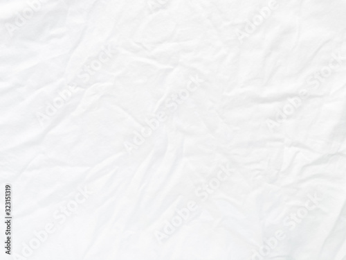 Wrinkled white cotton fabric surface for background and texture.