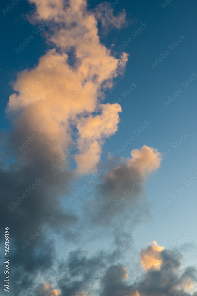 White and grey clouds on blue sky.