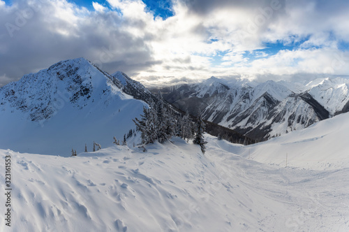 Kicking Horse, Golden, British Columbia, Canada. Beautiful View of Canadian Mountain Landscape during a vibrant sunny and cloudy morning sunrise in winter.