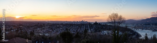 Burnaby  Greater Vancouver  British Columbia  Canada . Beautiful Panoramic View of the city from the top of the hill during a colorful winter sunset.