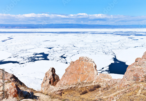 Baikal Lake at springtime. View from Cape Sagan-Khushun or Three Brothers on the ice drift in the Small Sea Strait. Beautiful seascape. Natural spring background photo