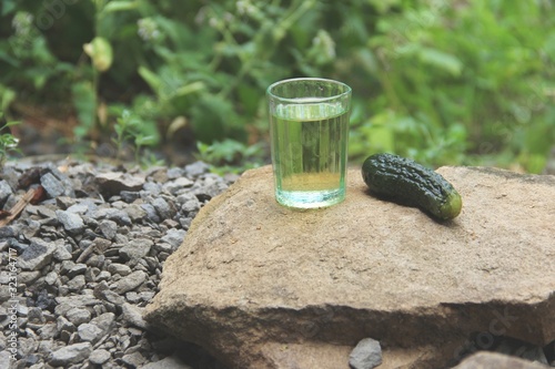 Fotografie glass of water and stones on wooden background
