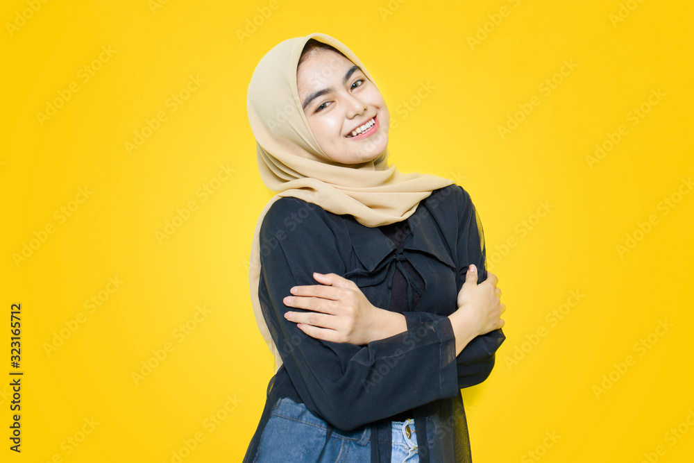 Portrait of Asian women with happy face on yellow background Portrait of Asian women with happy face on yellow background