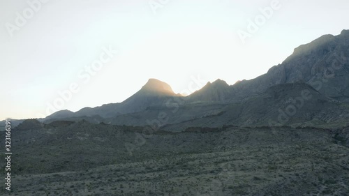 Horizontal Aerial pan of  Big Bend National Park with Sunrise over mountains. photo