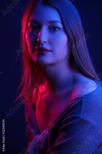 Fashionable Artistic Portrait Of A Beautiful Female Model In Bright Lights