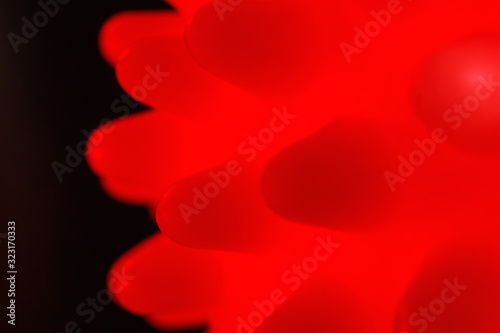 Chinese Coronavirus. Closeup microscopic view of 2019-nCoV coronavirus or HIV, cancer on black background. Bacterium, red infection.