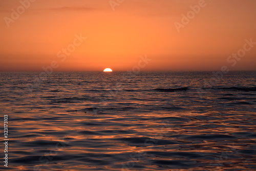 Beautiful red sunset Background in sea. A beautiful golden sunset reflecting.