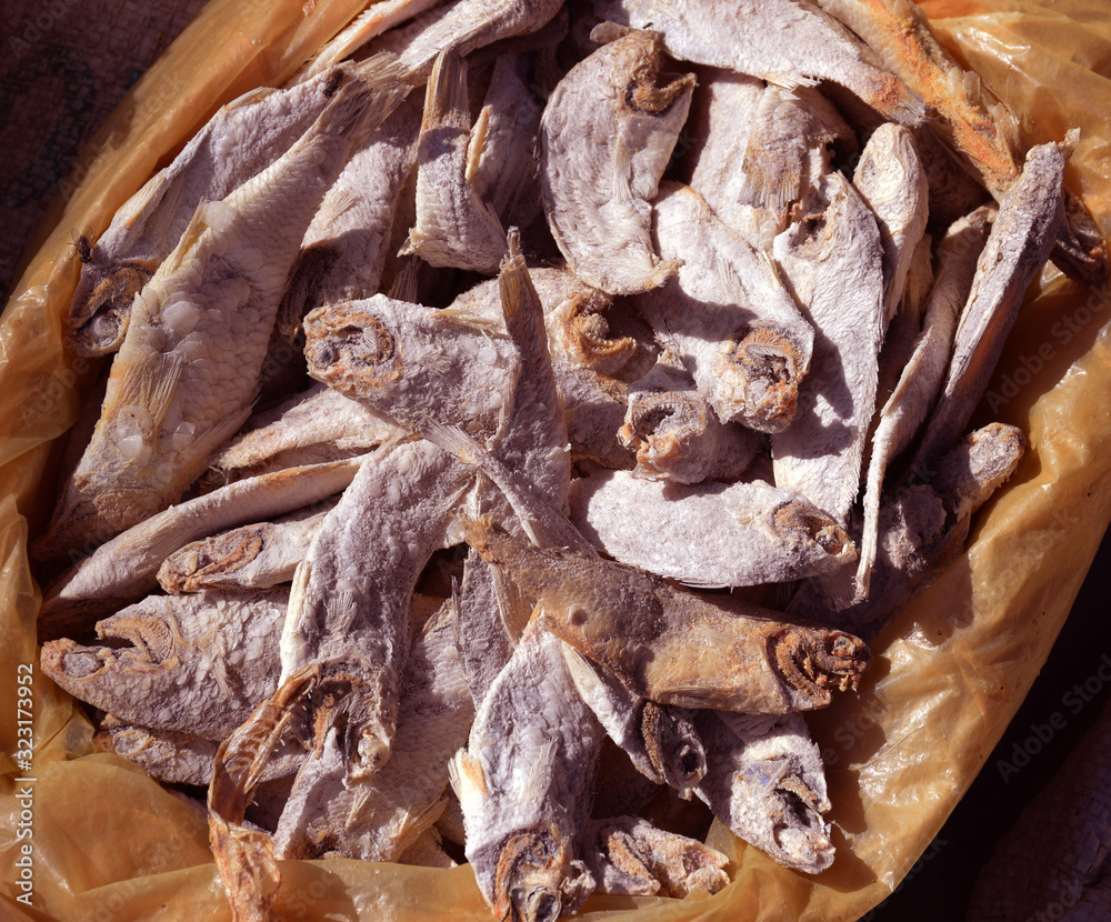 Many dried fish called stockfish for sale at european market Stock