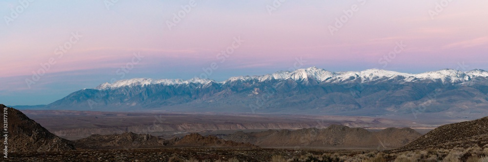 Panorama of the sunset from Owen's Valley in California with both the White Mountains and the Sierra Nevada