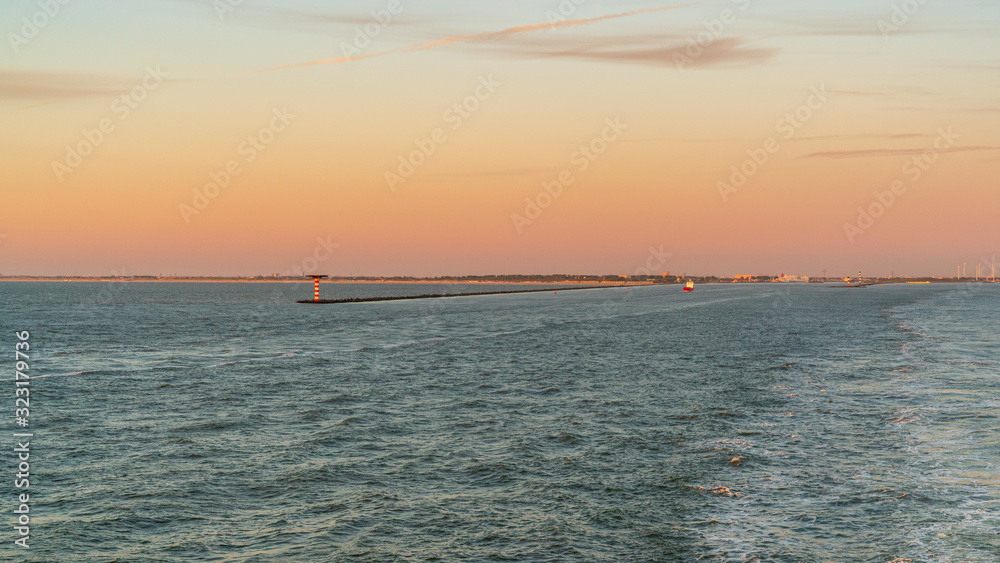 North Sea with a harbour light near the Port of Rotterdam, South Holland, Netherlands