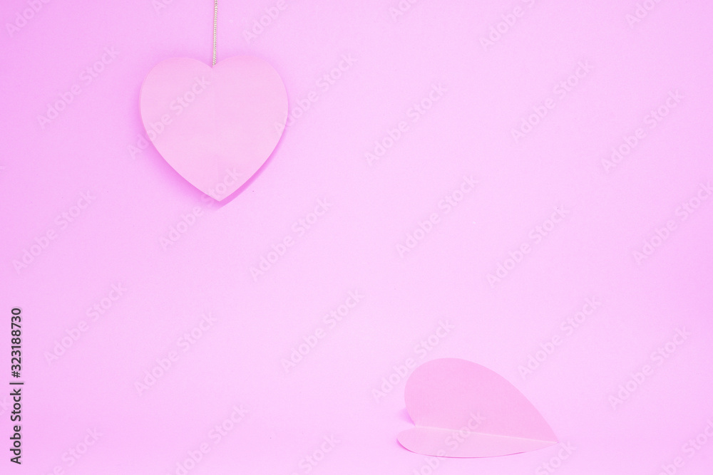 Couple ( 2 ) Pink Heart -  Pink Heart Paper Object on Pink Background - Valentine Day - Lover Concept  with Copy space - Hanging and Drop down                        