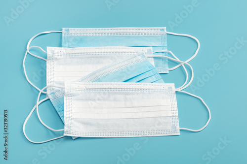 Medical mask on blue background.