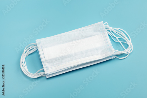Medical mask on blue background.