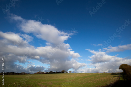 Rain clouds over farmland fields in the rural county of Hampshire