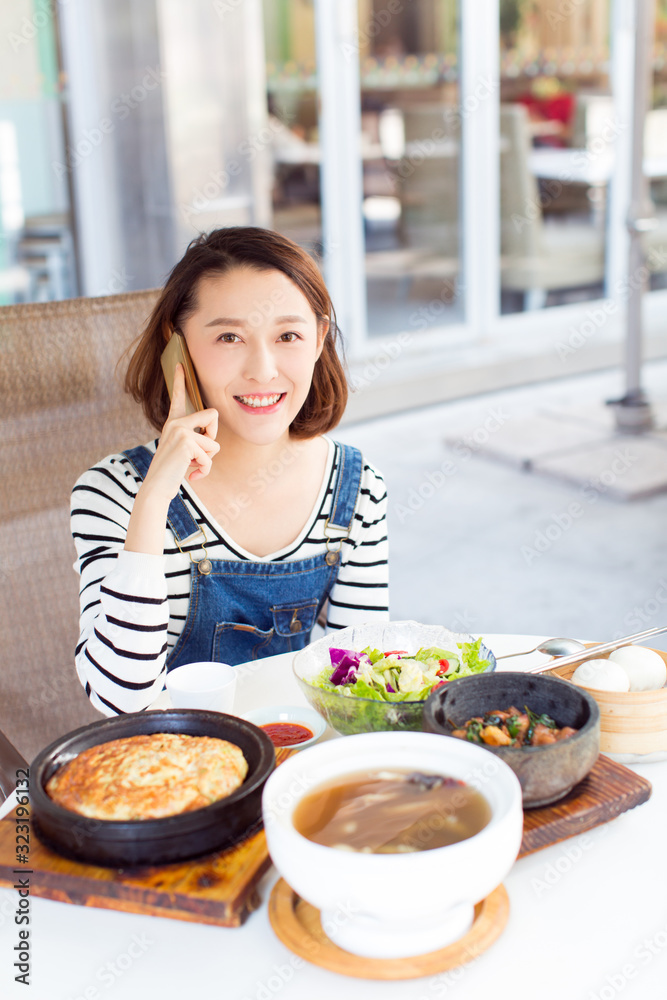 Happy woman eating out in a restaurant stock photo Happy woman eating out in a restaurant stock photo