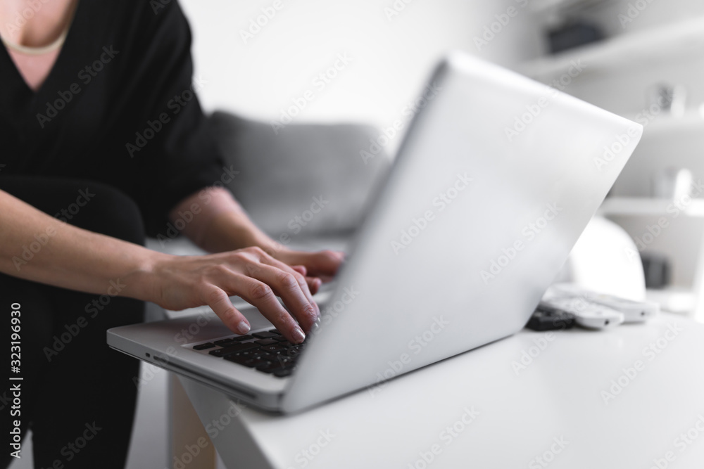 Person using laptop and typing on a keyboard. Person using laptop and typing on a keyboard.