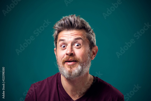 A portrait of bearded surprised man. People and emotions concept © Aleksej