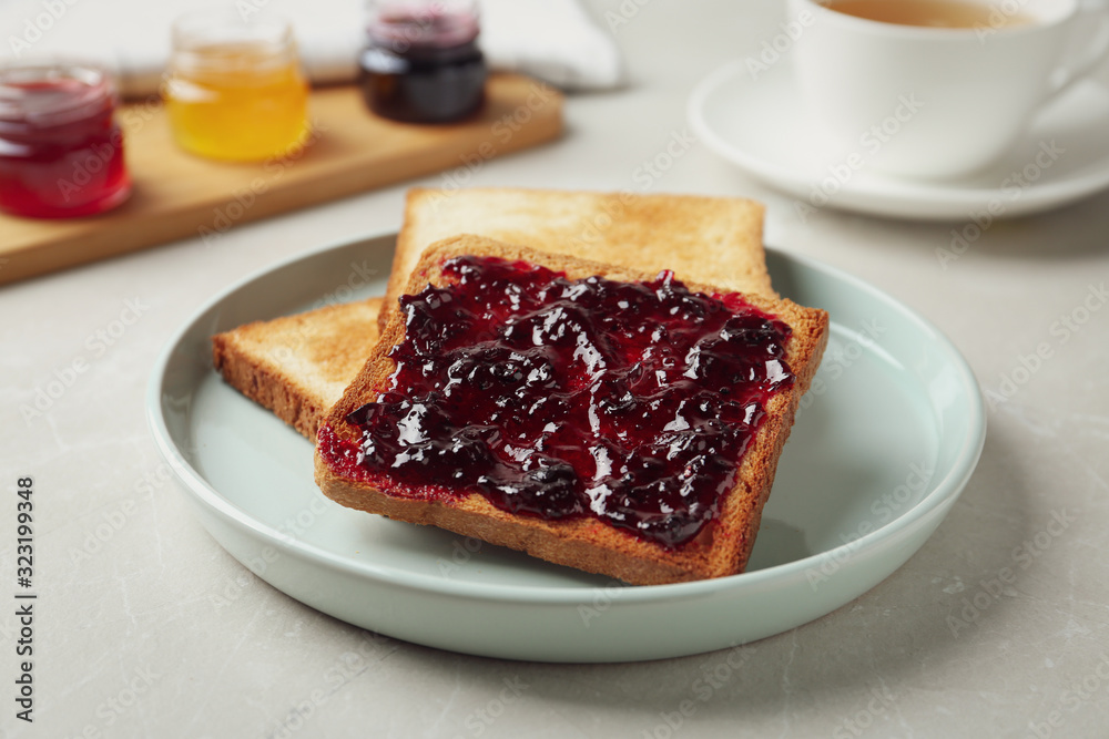 Delicious crispy toasts with jam on table Delicious crispy toasts with jam on table