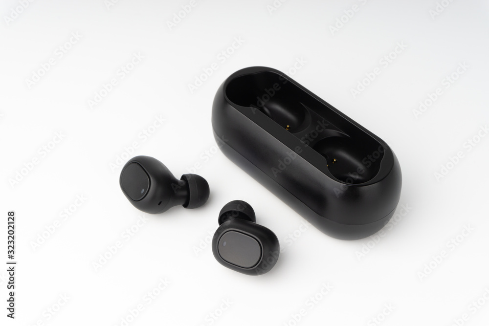 Wireless earbuds or earphones on white background. Copy space and technology concept Wireless earbuds or earphones on white background. Copy space and technology concept