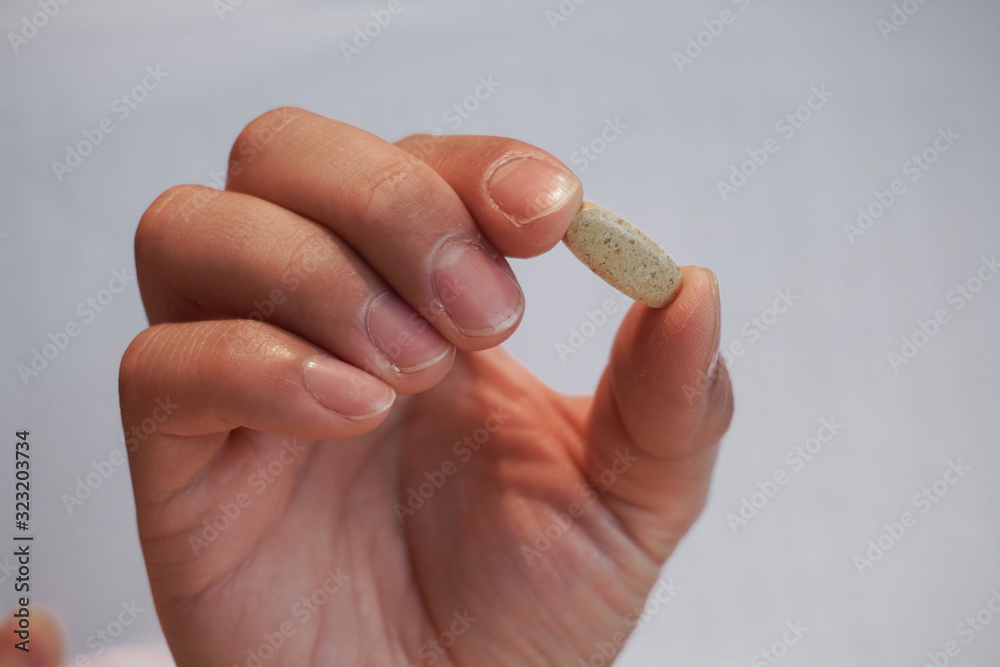 hand with medical pills hearthcare hand with medical pills hearthcare