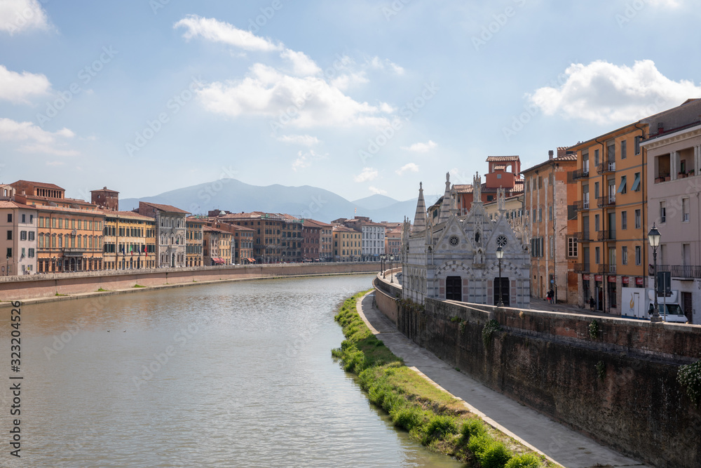 Panoramic view on historic center of Pisa city and river Arno