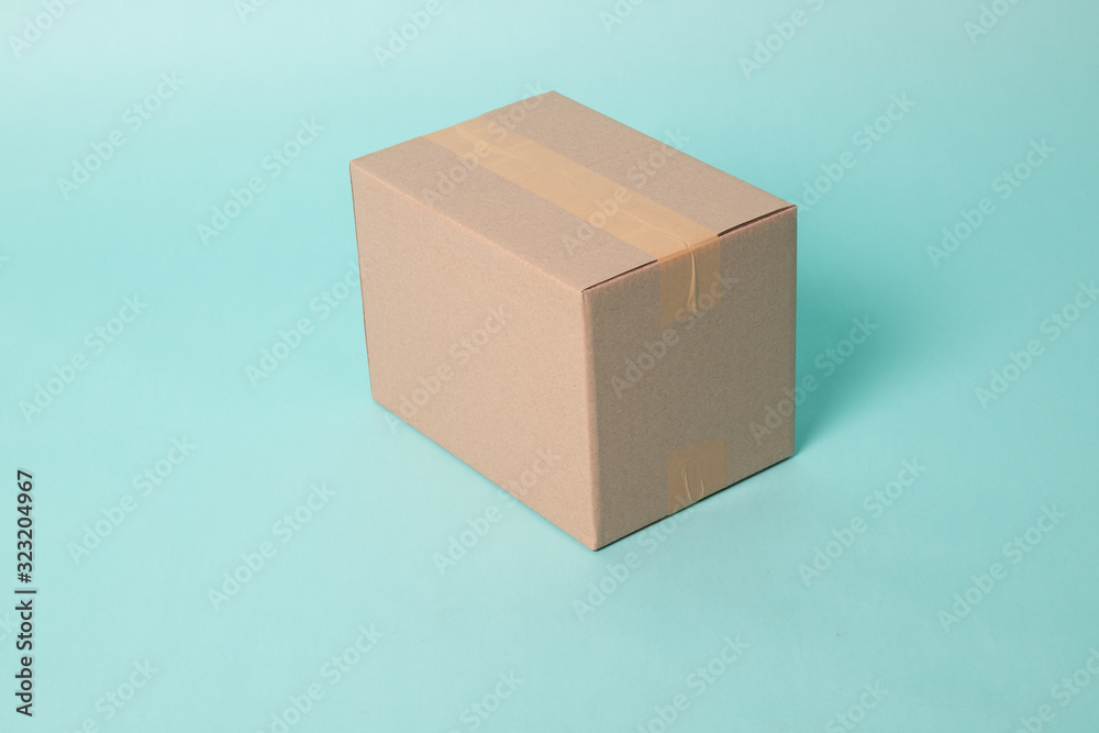 Obraz premium Closed cardboard box taped up ready to delivery