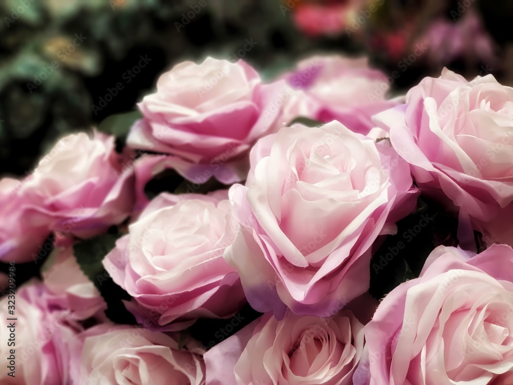 Fototapeta premium bouquet of pink roses.Fake flowers for Interior.Artificial roses made by fabric and plastic use decorated.14 February is Valentine day. love wallpaper.Pink roses vintage style background.