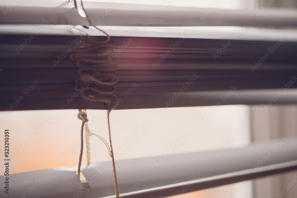 Half open horizontal blinds with gap for view. Half open horizontal blinds with gap for view.