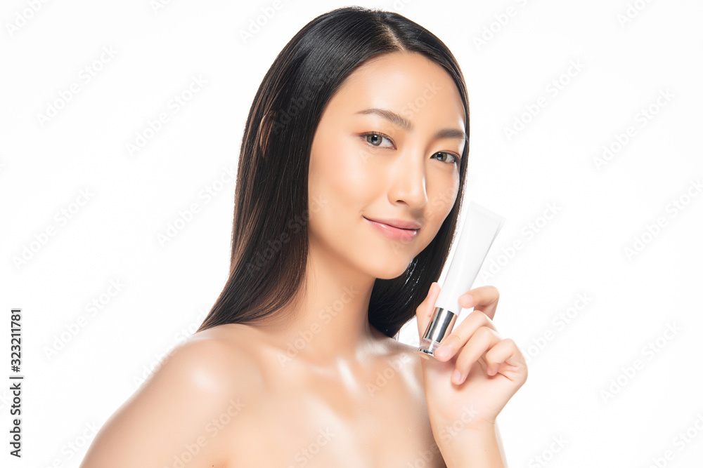 Beautiful Young Asian Woman with Holding luxury white clean tube, Clean and Fresh skin, on white background, Beauty Cosmetics Concept. Beautiful Young Asian Woman with Holding luxury white clean tube, Clean and Fresh skin, on white background, Beauty Cosmetics Concept.