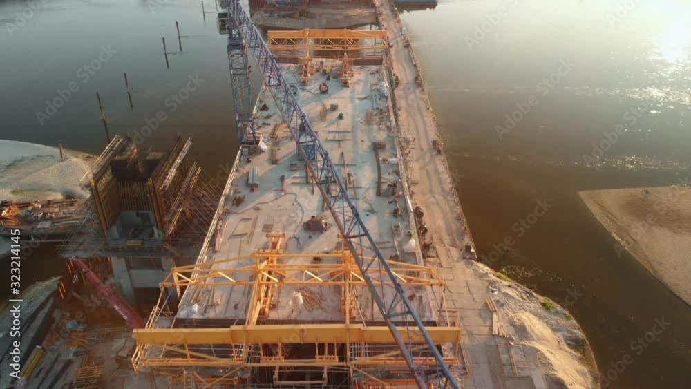 Aerial overhead shot of a large bridge construction site.