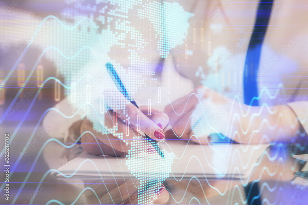 Double exposure of hands making notes with forex chart huds. Stock market concept. Double exposure of hands making notes with forex chart huds. Stock market concept.