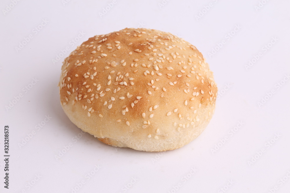 delicious bread rolls on colored background