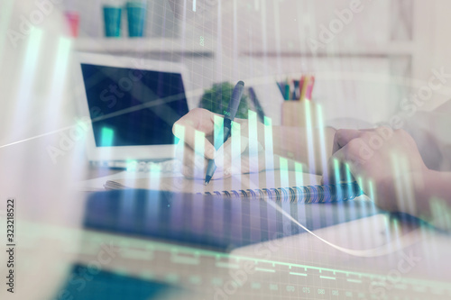 Financial graph displayed on woman's hand taking notes background. Concept of research. Double exposure